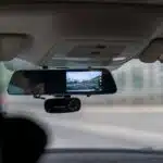 car side mirror with water droplets