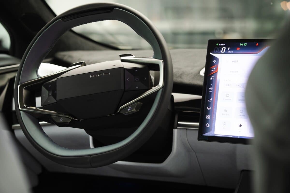 a car dashboard with an electronic device in the center