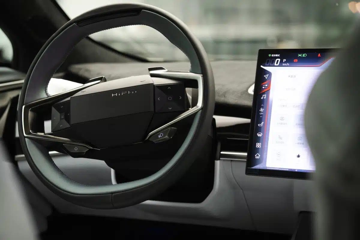 a car dashboard with an electronic device in the center