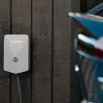 a car plugged in to a wall charger